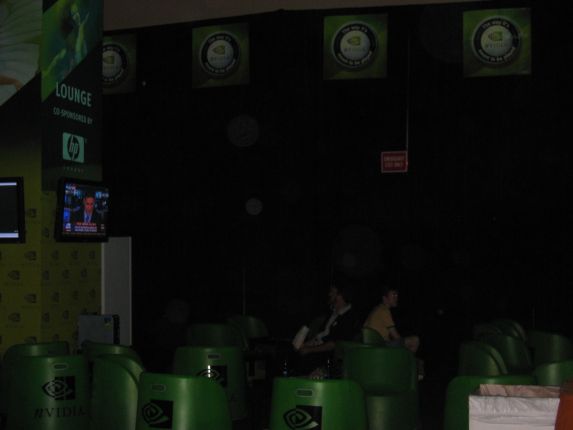The nVidia Lounge, complete with flat panel TVs and really goofy green chairs (qc041003.jpg, 573w x 430h )