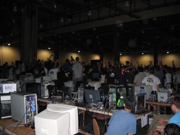 The teeming masses gathered around the NOC begging for swag (qc041019.jpg, 573w x 430h )