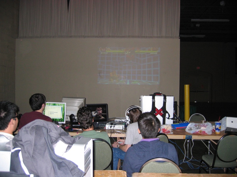 These guys brought an Xbox 360 and a projector.  In the dark BYOC, the image looked pretty good on the wall. (qc071005.jpg, 800w x 600h )