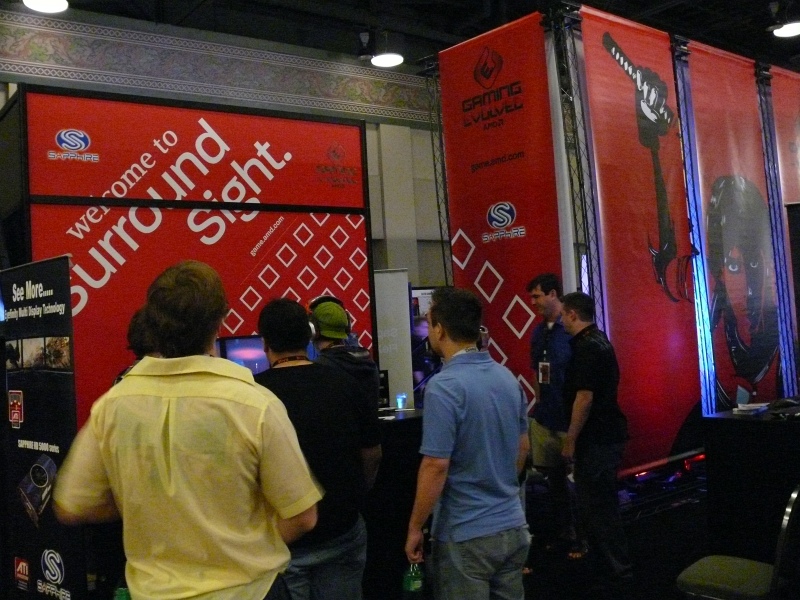 Part of the large AMD + ATI + Sapphire booth. (qc100033.jpg, 800w x 600h )